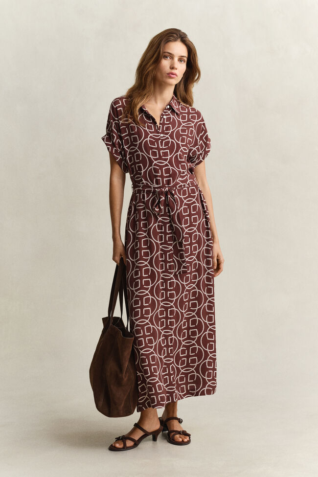 Kl&auml;nning med holk&auml;rm och monogram