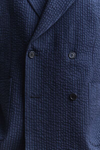 Indigof&auml;rgad kavaj i b&auml;ckeb&ouml;lja