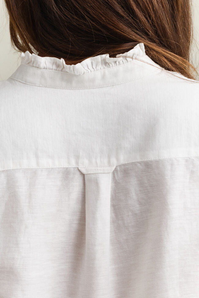 Blus i linneblandning med volang