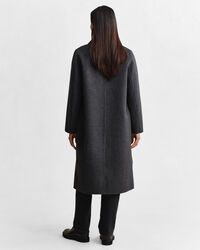 Rutig kappa med handsydda detaljer